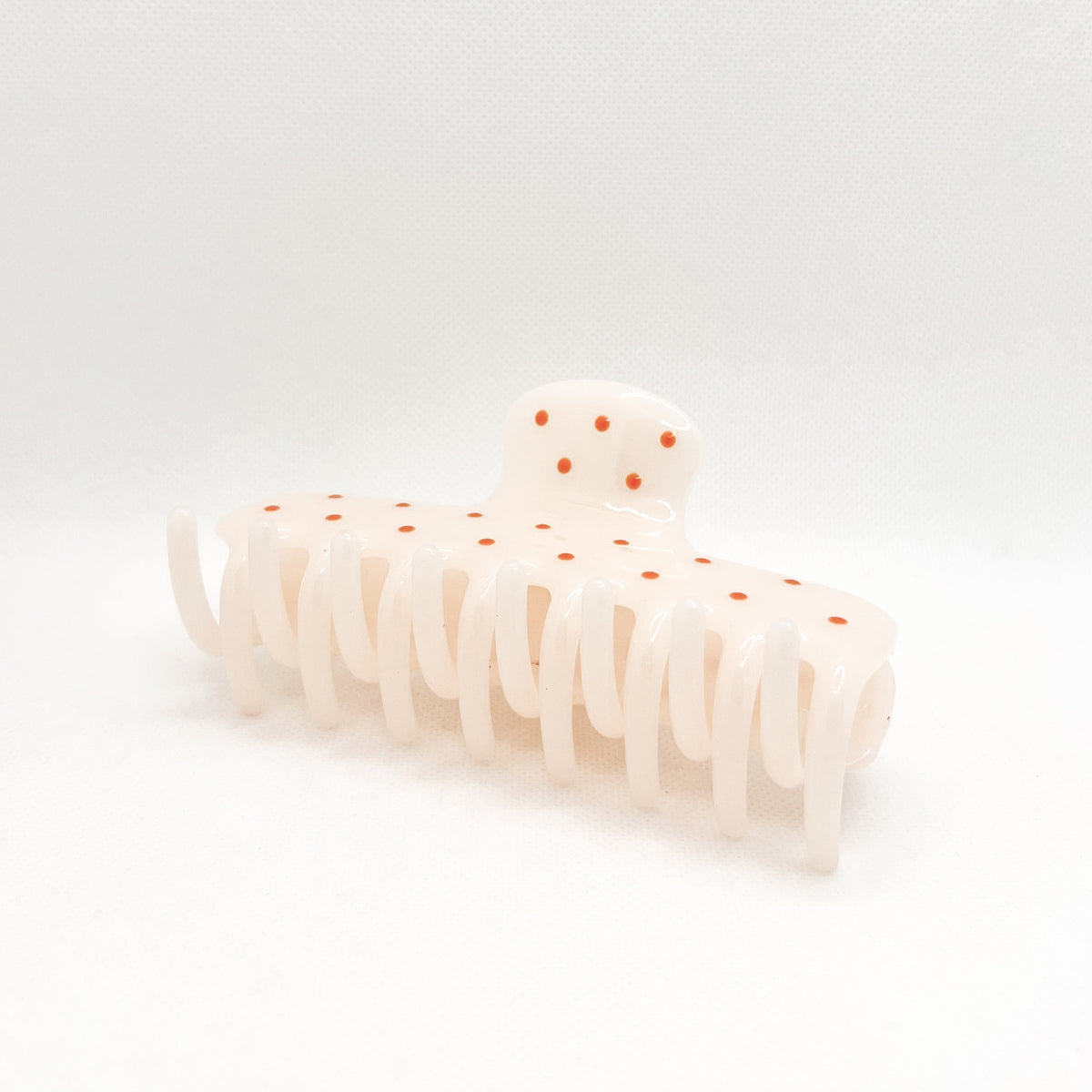 white polka dot hair clip