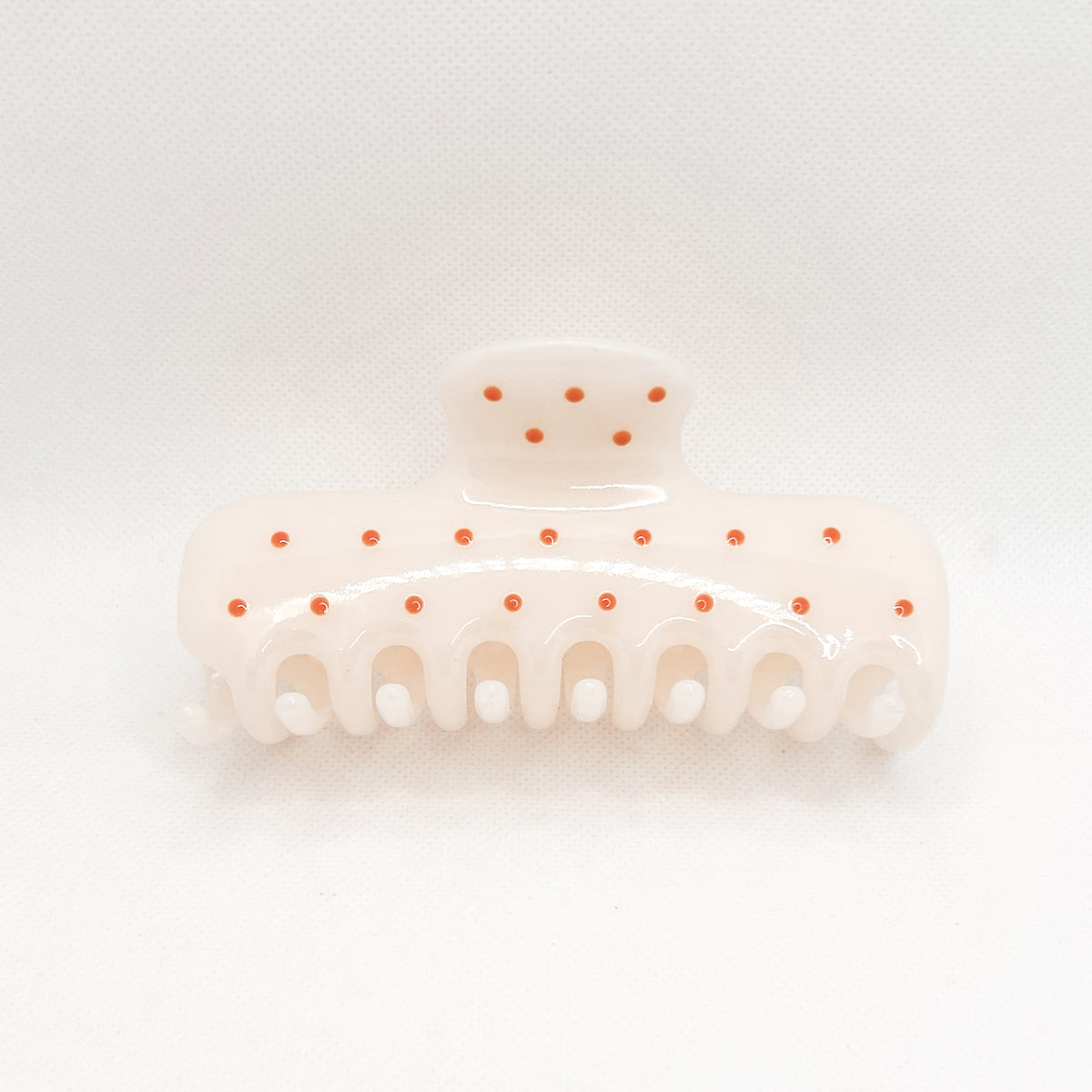 white polka dot hair clip