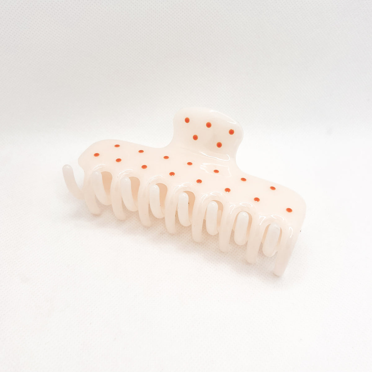 white polka dot hair clip