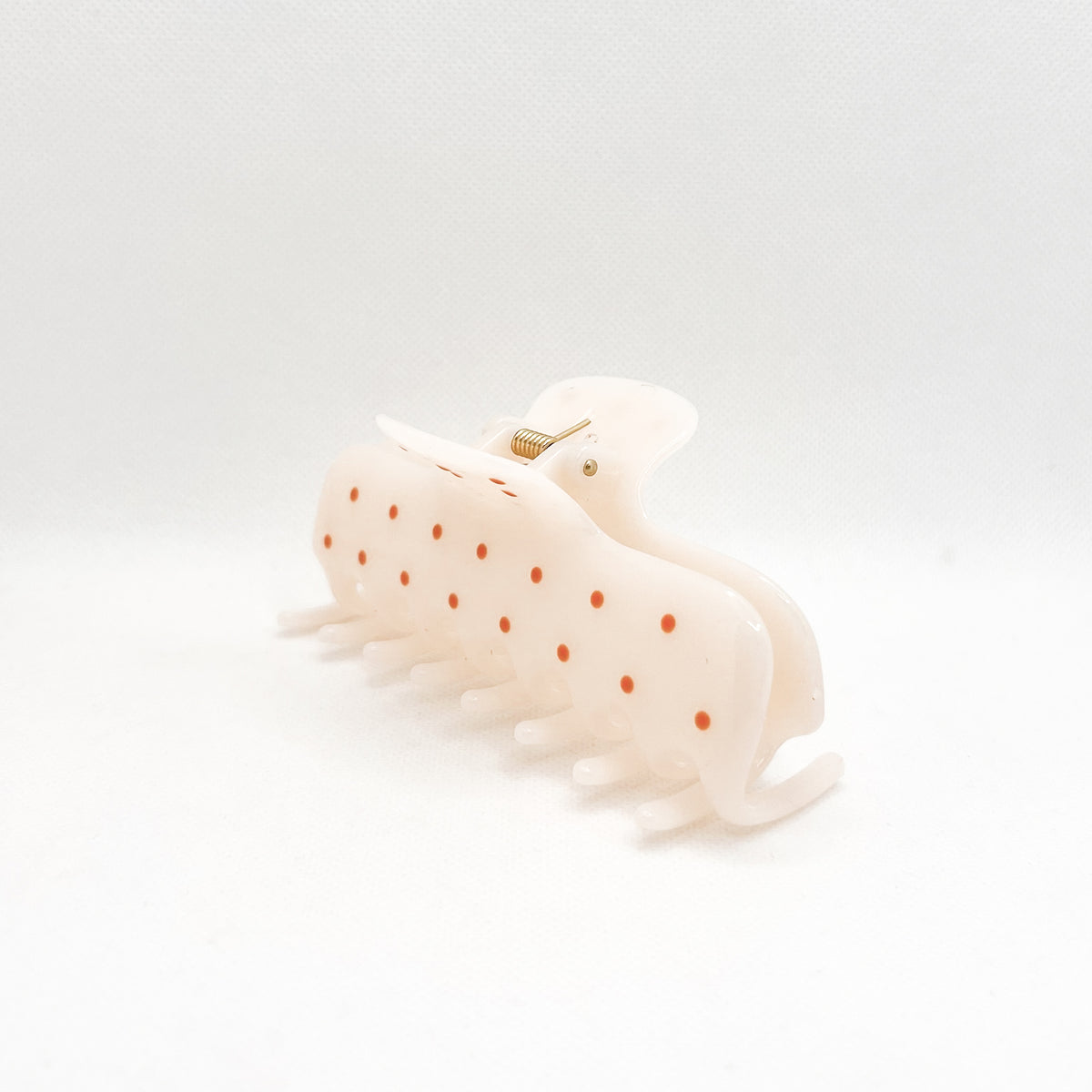 white polka dot hair clip